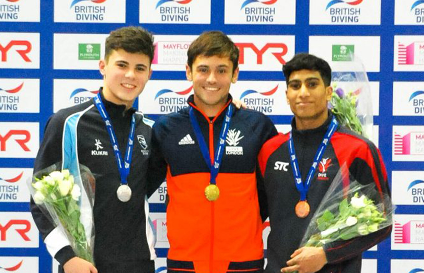 Tom Daley scores top marks at British National Diving Cup in front of new baby Robbie, husband Lance and sell-out Plymouth crowd
